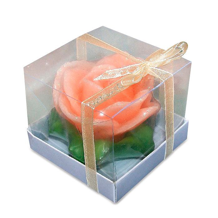 свеча роза оранжевая на листьях